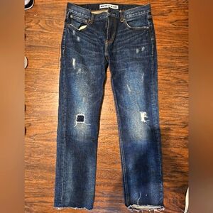 Distressed blue jeans